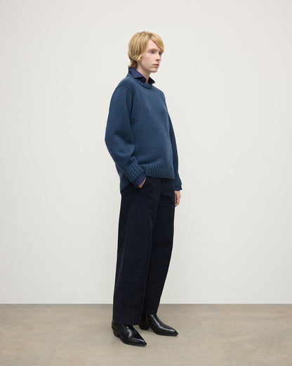 Model wearing Johnstons of Elgin AW25 Women's Knitwear Heather Navy Relaxed Navy Cashmere Jumper Side View KAB05562HD7321