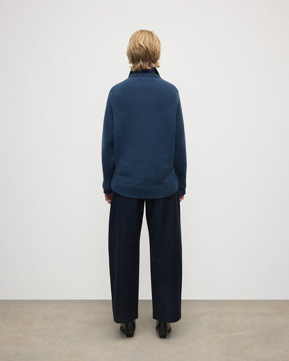 Model wearing Johnstons of Elgin AW25 Women's Knitwear Heather Navy Relaxed Navy Cashmere Jumper back View KAB05562HD7321