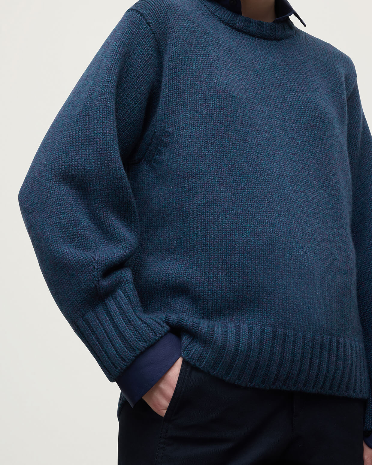 Model wearing Johnstons of Elgin AW25 Women's Knitwear Heather Navy Relaxed Navy Cashmere Jumper details  KAB05562HD7321