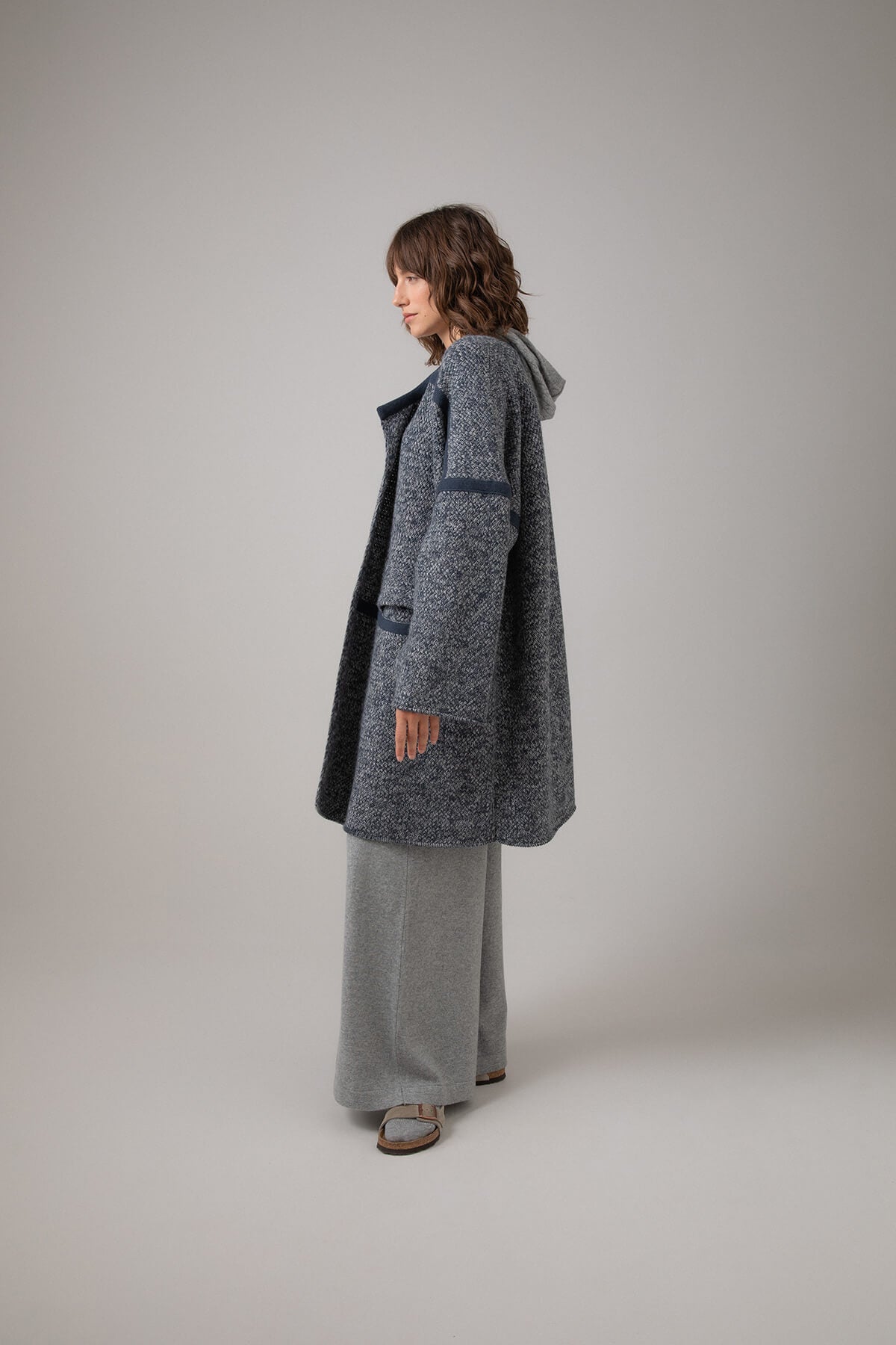 Johnstons of Elgin Basket Weave Cashmere Cape Coat worn with a Grey Cable Hoodie and Grey Wide Leg Trousers KAC05057Q23741ONE