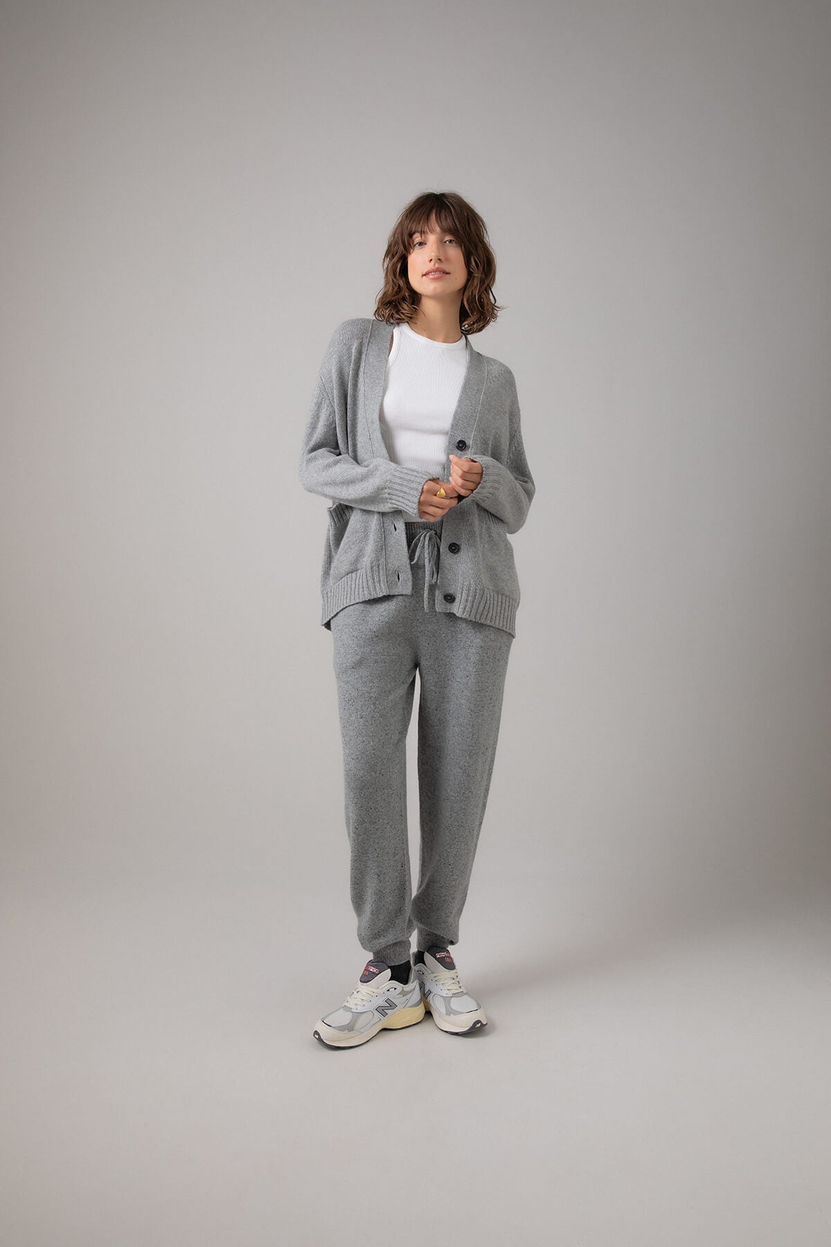 Johnstons of Elgin Women's Relaxed Fit Cashmere Cardigan in Light Grey worn with a White T-Shirt and Grey Cashmere Joggers KAC05087HA0308