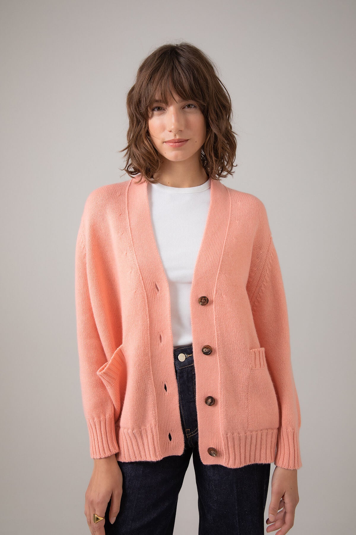 Johnstons of Elgin Women's Relaxed Fit Cashmere Cardigan in Sea Pink worn with a White T-Shirt KAC05087SE4916