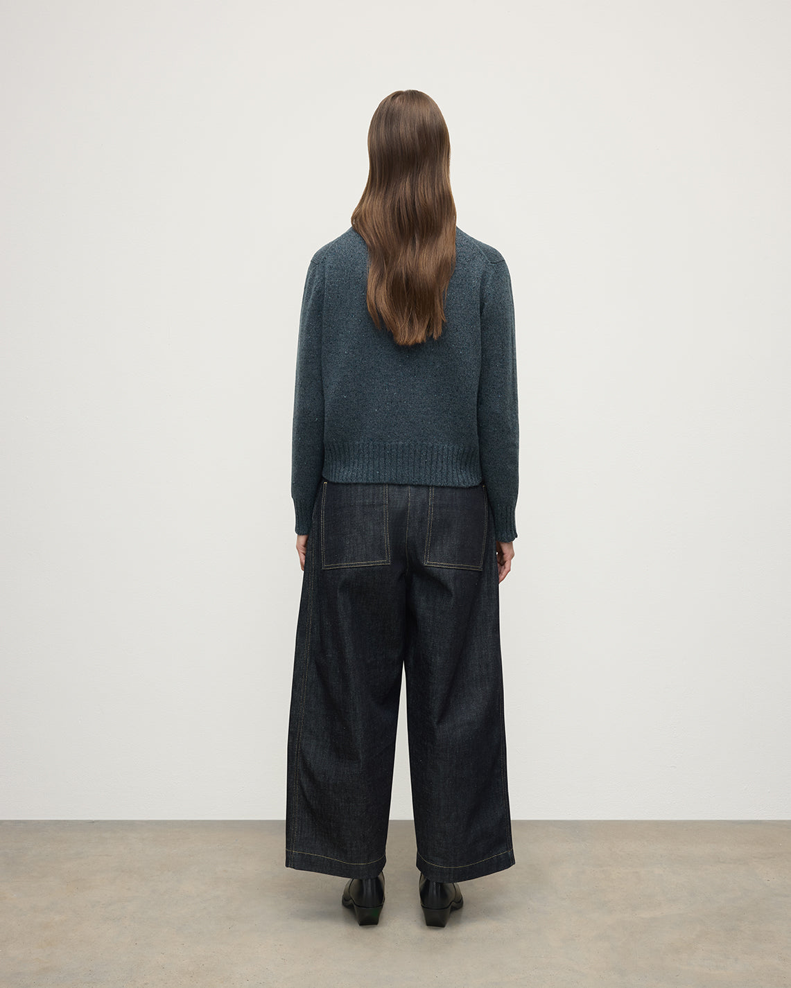 Model wearing Johnstons of Elgin AW25 Women's Knitwear Storm Donegal Donegal Blue Cashmere Jumper back View KAC05289006336