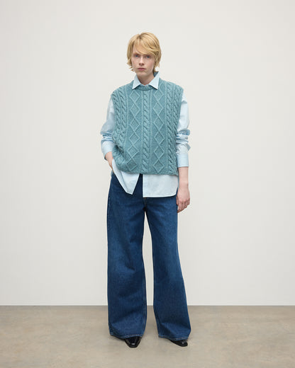 Model wears Johnstons of Elgin AW25 Women's Knitwear Seascape Aran Cable Green Cashmere Tank Front View KAC05321HC0038