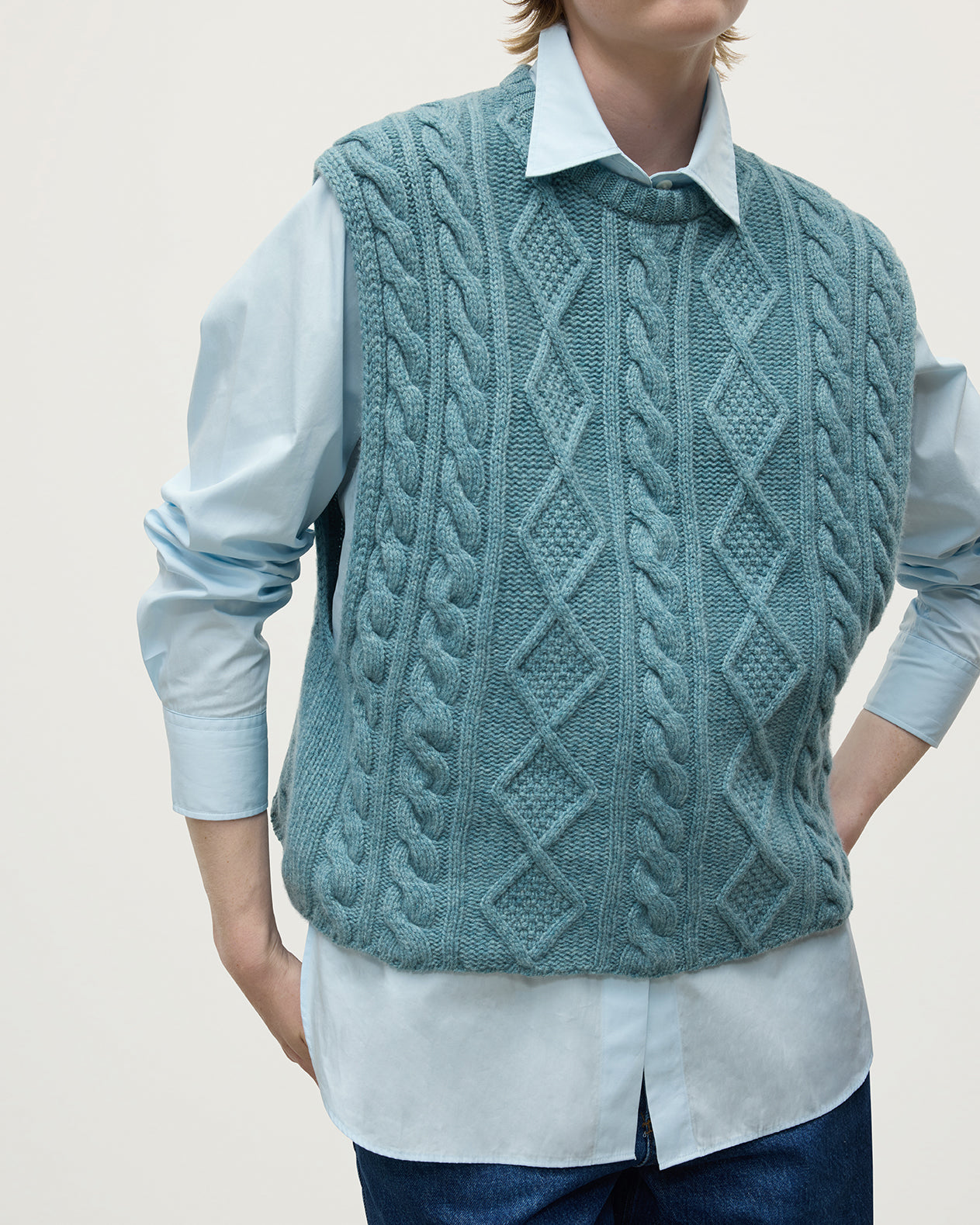 Model wears Johnstons of Elgin AW25 Women's Knitwear Seascape Aran Cable Green Cashmere Tank Details KAC05321HC0038