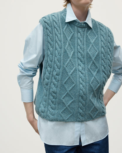 Model wears Johnstons of Elgin AW25 Women's Knitwear Seascape Aran Cable Green Cashmere Tank Details KAC05321HC0038