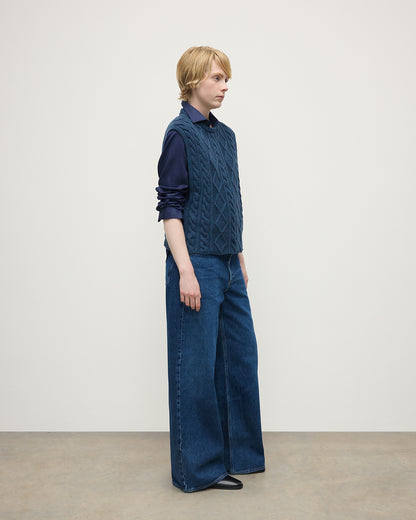 Model wears Johnstons of Elgin AW25 Women's Knitwear Heather Navy Aran Cable Navy Cashmere Tank Side View KAC05321HD7321