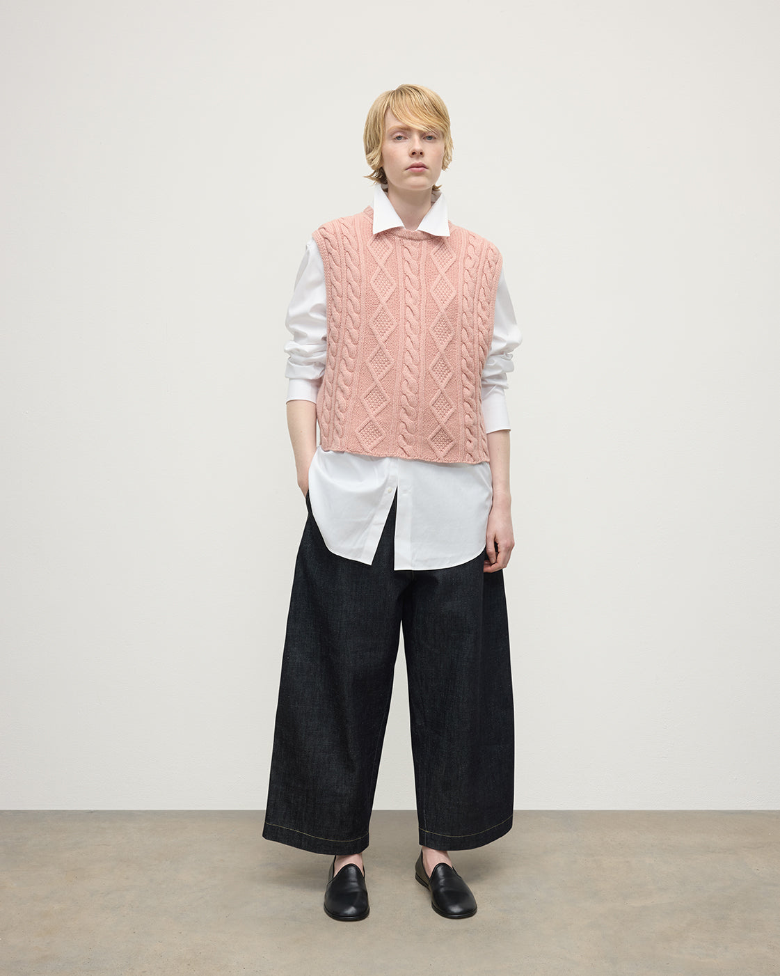 model wearing Johnstons of Elgin AW25 Women's Knitwear Nude Aran Cable Pink Cashmere Tank Front View KAC05321SE0740