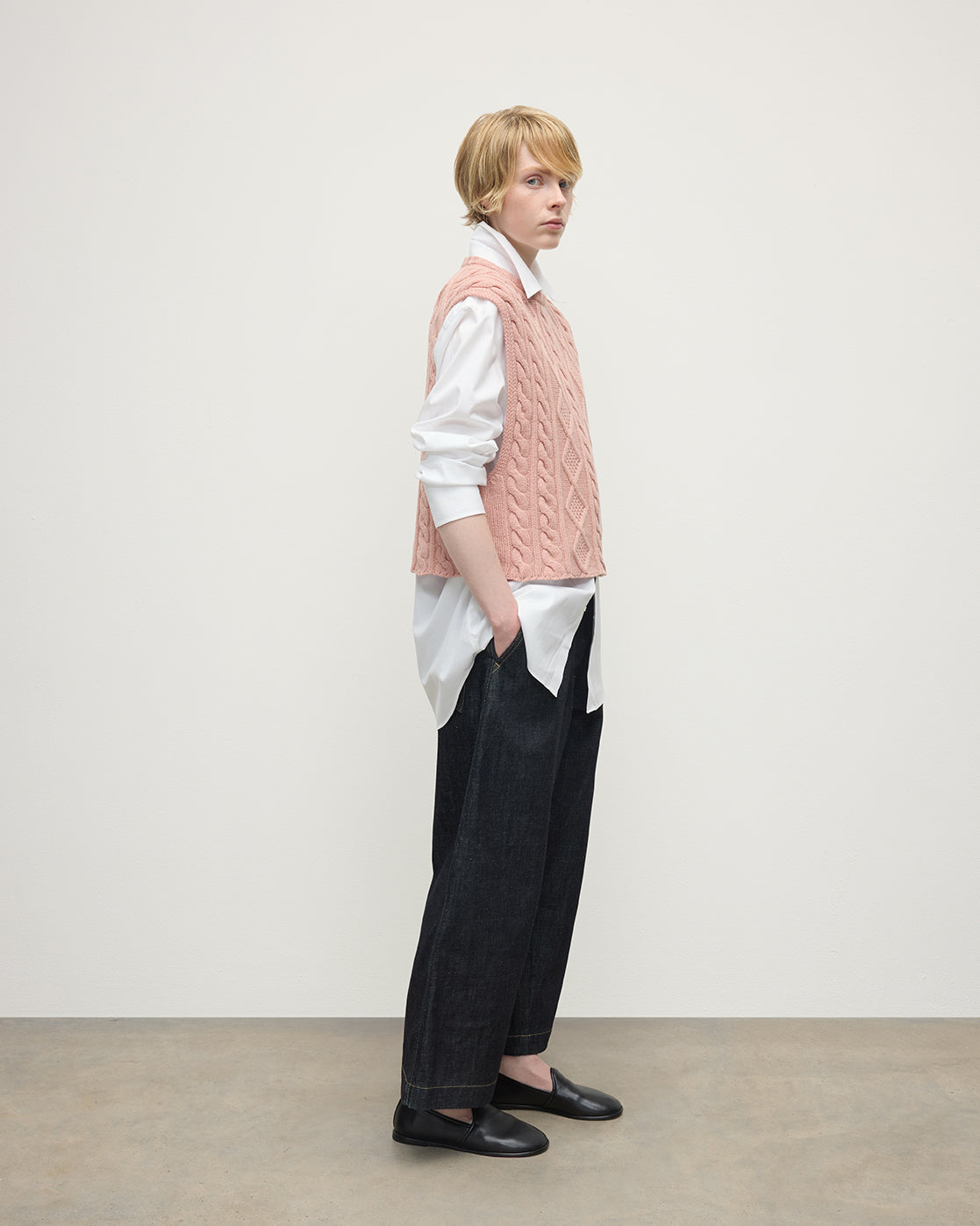 model wearing Johnstons of Elgin AW25 Women's Knitwear Nude Aran Cable Pink Cashmere Tank Side View KAC05321SE0740