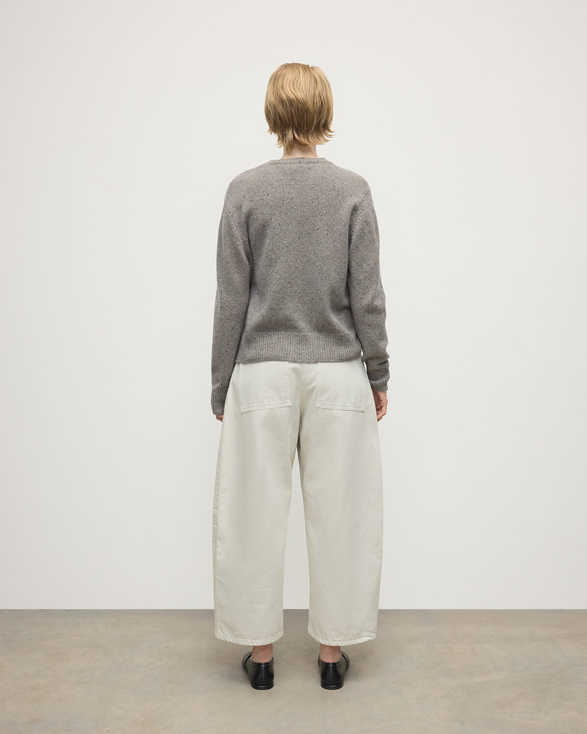 Model wears Johnstons of Elgin AW25 Women's Knitwear Peregrine Donegal Donegal Cashmere Grey Cardigan Back View KAC05494006335