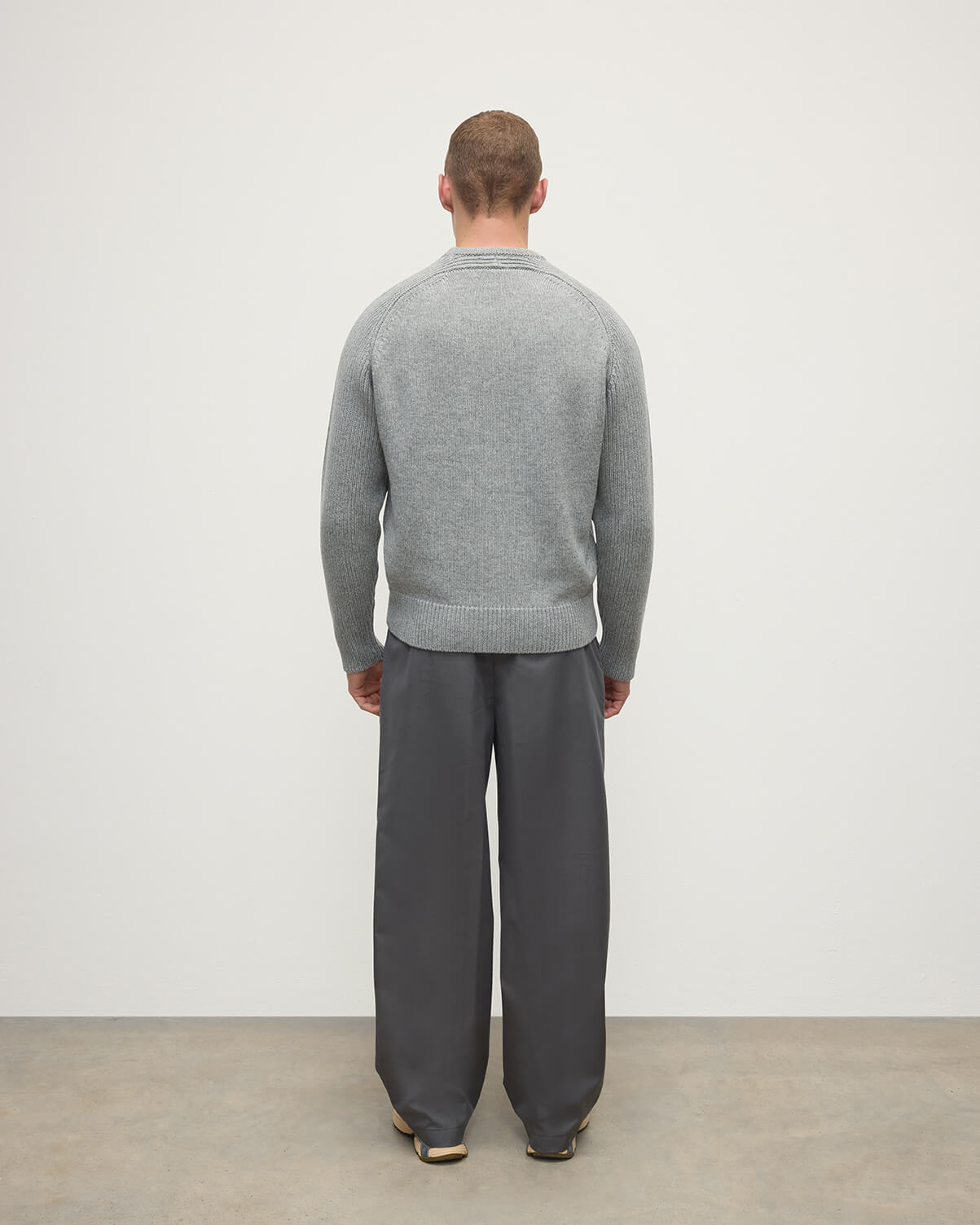 Back view of model wearing Johnstons of Elgin AW25 Men's Knitwear Light Grey Ribbed Grey Cashmere Jumper KAC05540HA0308