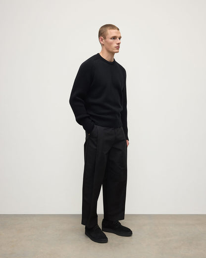 Side View model wearing Johnstons of Elgin AW25 Men's Knitwear Black Ribbed Black Cashmere Jumper KAC05540SA7210