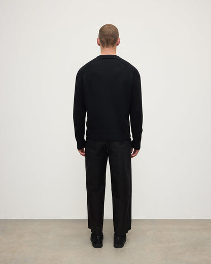 Back View model wearing Johnstons of Elgin AW25 Men's Knitwear Black Ribbed Black Cashmere Jumper KAC05540SA7210