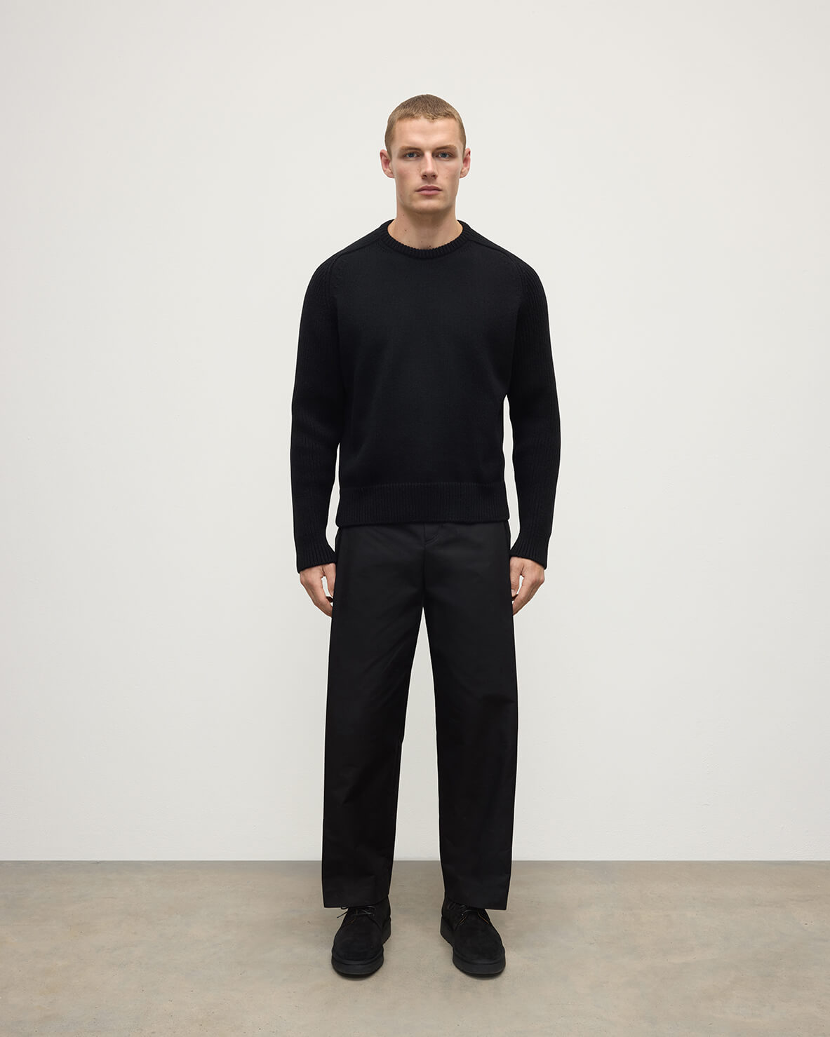 Front View model wearing Johnstons of Elgin AW25 Men's Knitwear Black Ribbed Black Cashmere Jumper KAC05540SA7210