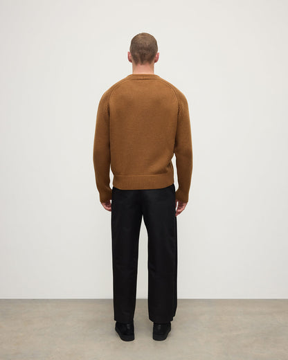 back view of model wearing Johnstons of Elgin AW25 Men's Knitwear Dark Camel Ribbed Camel Cashmere Jumper KAC05540SB4620