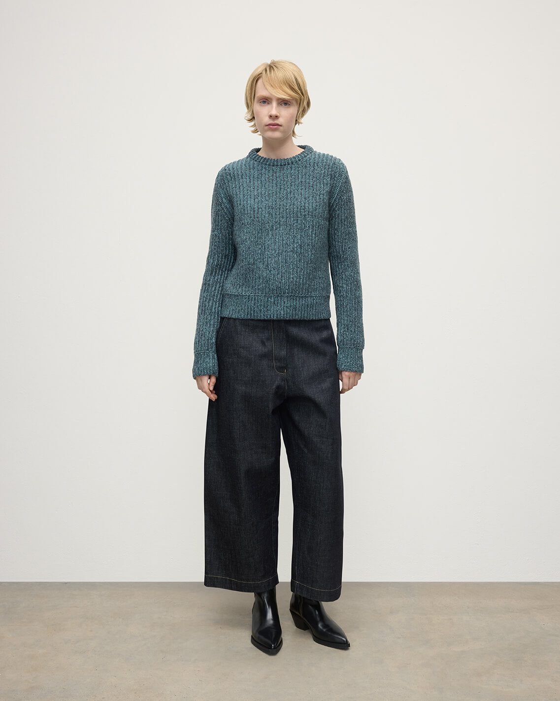 Model wearing Johnstons of Elgin AW25 Women's Knitwear Storm Donegal & Seascape High Neck Donegal Cashmere Blue Jumper Front View KAC05590Q25392