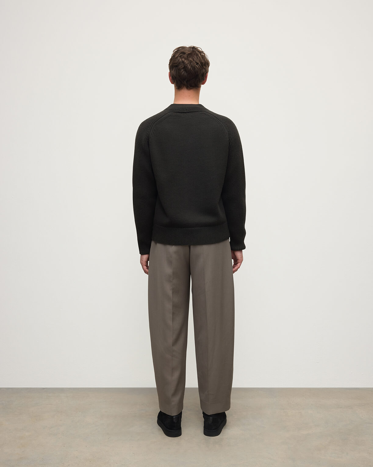 Model wears Johnstons of Elgin AW25 Men's Knitwear Iron Ribbed Cashmere Grey Cardigan Back KAC05601SC7330