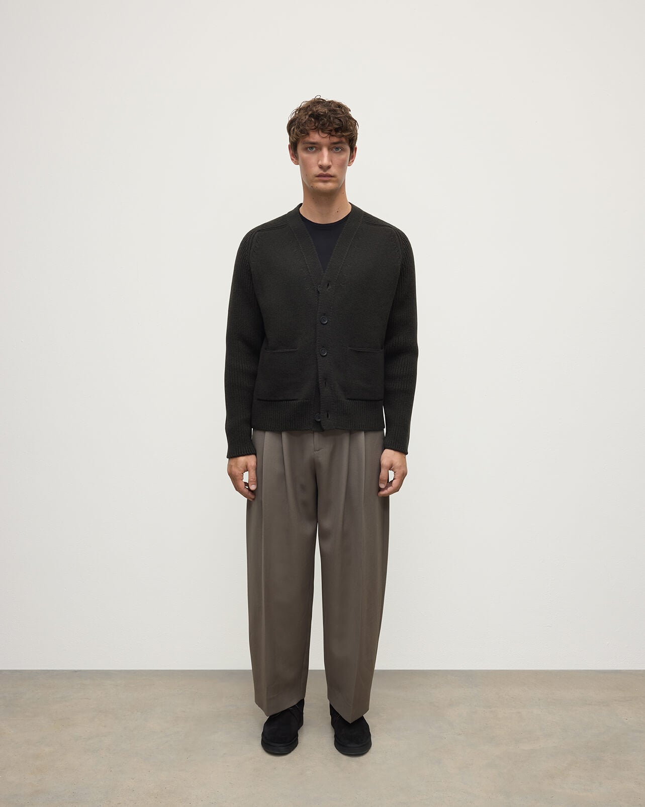 Model wears Johnstons of Elgin AW25 Men's Knitwear Iron Ribbed Cashmere Grey Cardigan Front KAC05601SC7330