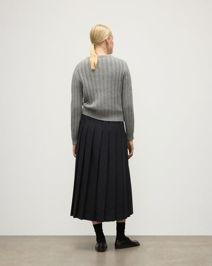 BACK OF JOHNSTONS OF ELGIN WOMENS LECHT CREW SWEATER GREY 100% CASHMERE ON A MODEL WORN WITH A LONG LE KILT CHARCOAL KILT KAC05706HA0400