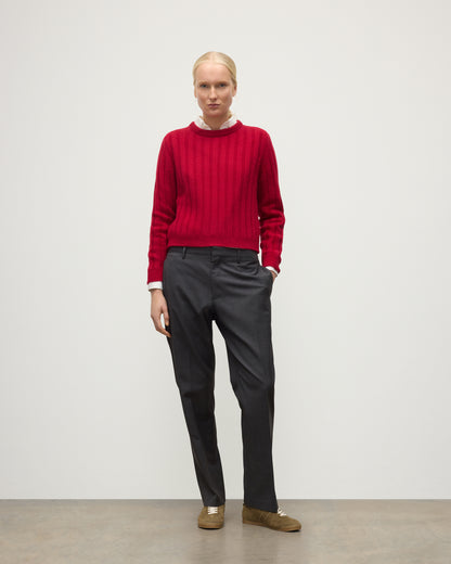 MODEL WEARING JOHNSTONS OF ELGIN WOMENS LECHT CREW SWEATER RED OVER WHITE SHIRT WITH GREY TROUSERS ANDTRAINERS  KAC05706SE5325