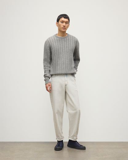 JOHNSTONS OF ELGIN MENS PEEL CREW SWEATER GREY 100% CASHMERE OVER A WHITE T-SHIRT WITH WHITE JEANS AND BLACK LOAFERS KAC05751HA0400