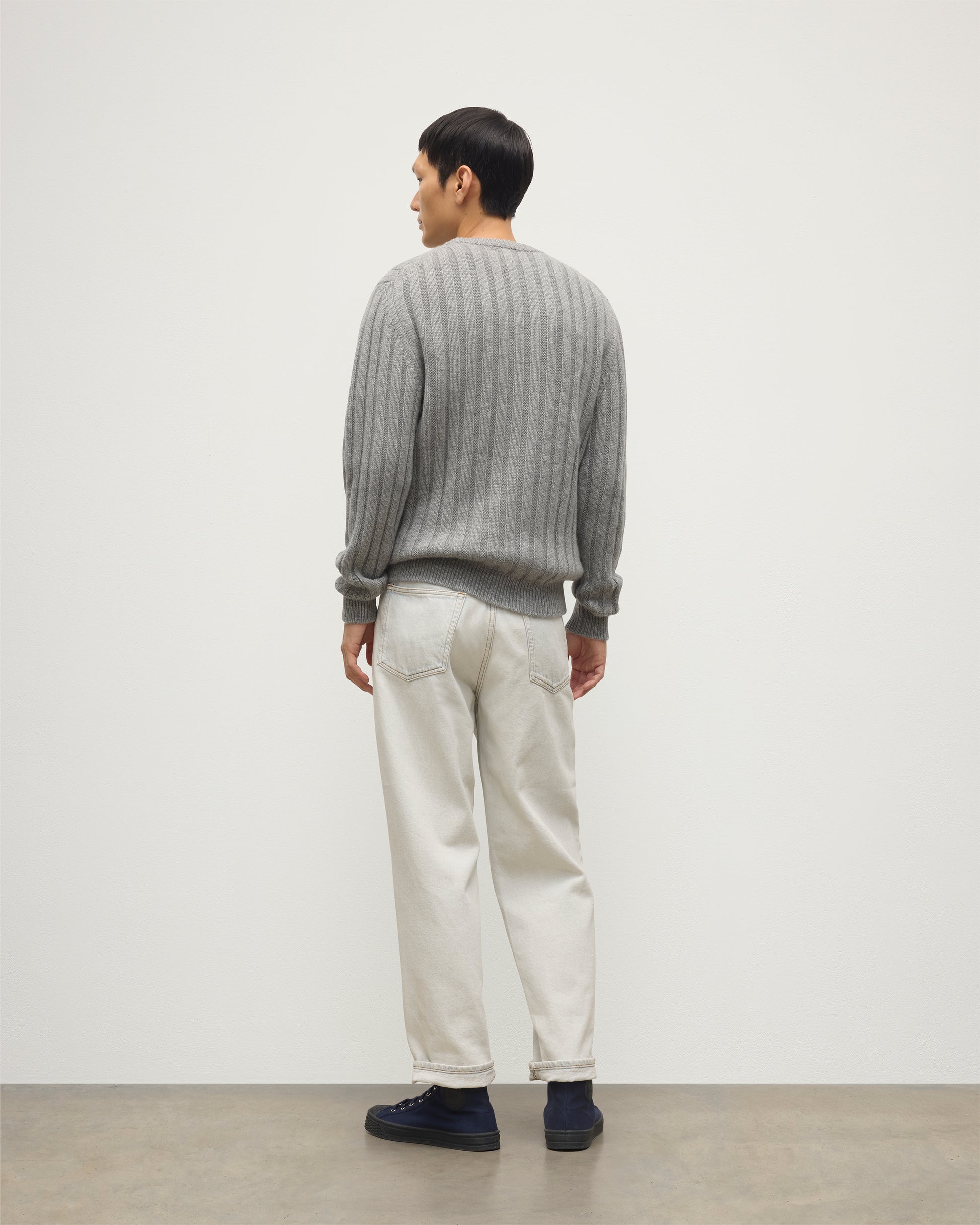 JOHNSTONS OF ELGIN MENS PEEL CREW SWEATER GREY 100% CASHMERE OVER A WHITE T-SHIRT WITH WHITE JEANS AND BLACK LOAFERS KAC05751HA0400