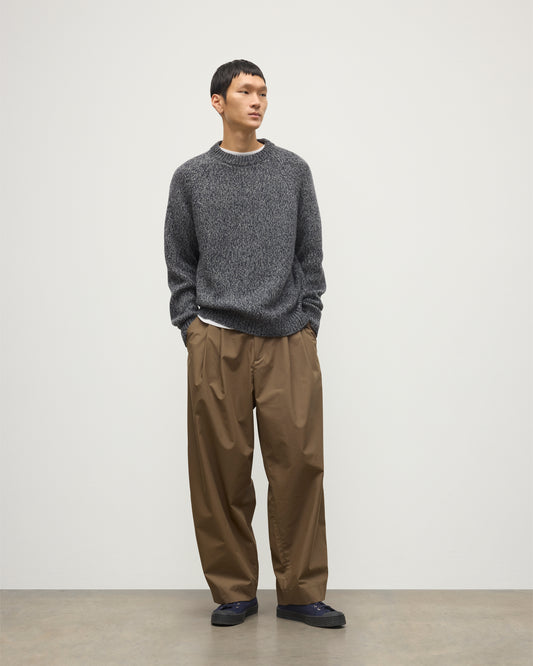 MALE MODEL WEARS JOHNSTONS OF ELGIN FYFE CREW SWEATER NAVY 100% CASHMERE OVER WHITE T-SHIRT AND BROWN TROUSERS  KAC05753006876