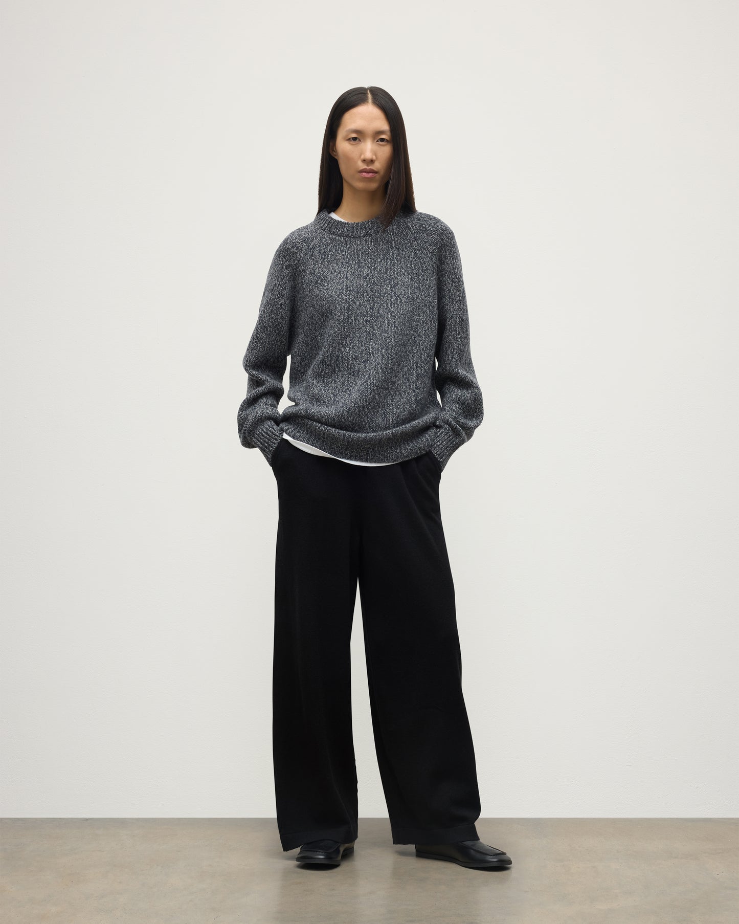 FEMALE MODEL WEARS JOHNSTONS OF ELGIN FYFE CREW SWEATER NAVY 100% CASHMERE WITH BLACK TROUSERS UAC05753006876