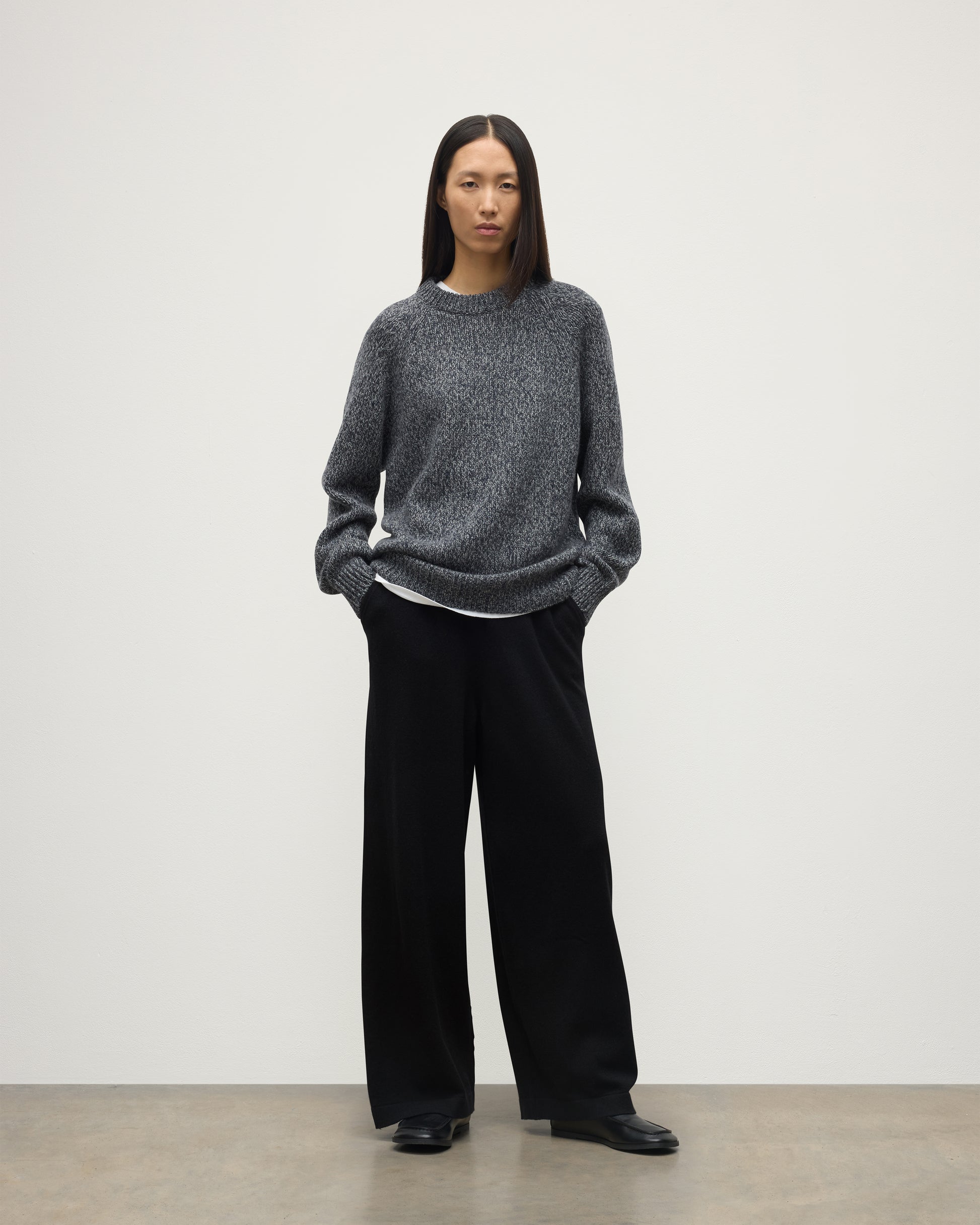 FEMALE MODEL WEARS JOHNSTONS OF ELGIN FYFE CREW SWEATER NAVY 100% CASHMERE WITH BLACK TROUSERS UAC05753006876