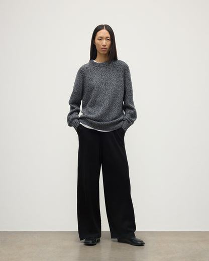 FEMALE MODEL WEARS JOHNSTONS OF ELGIN FYFE CREW SWEATER NAVY 100% CASHMERE WITH BLACK TROUSERS UAC05753006876