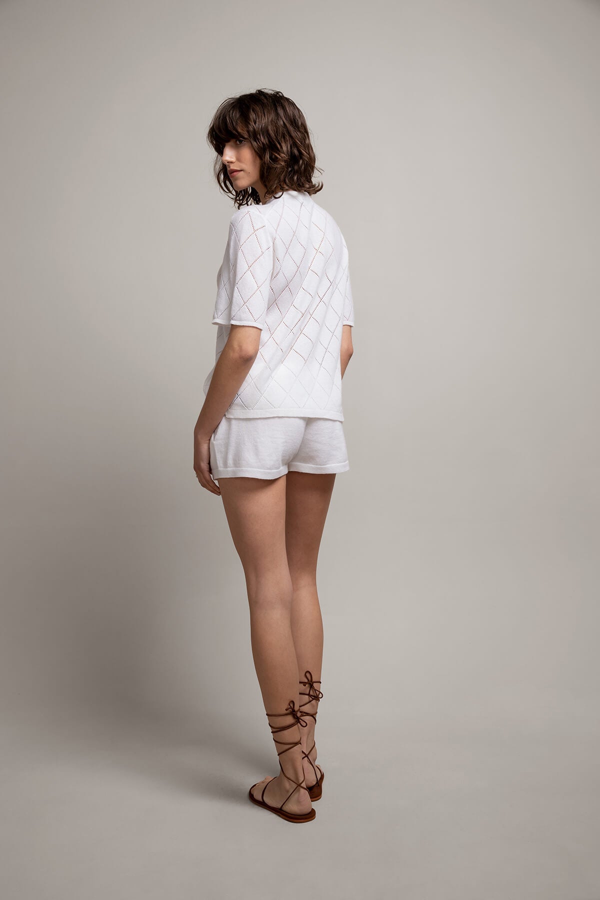 Back of Johnstons of Elgin Women’s Cashmere Camisole Shorts in Luna White on grey background KAI05078SA1911