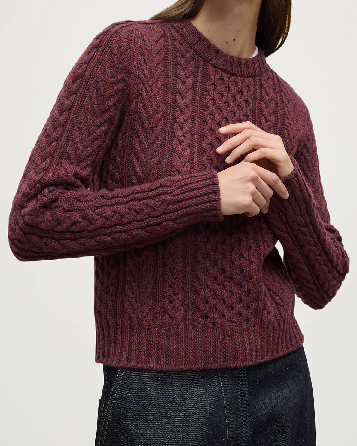 Model wears Johnstons of Elgin AW25 Women's Knitwear Damson Aran Cable Purple Cashmere Jumper  Details KAI05086HE7064