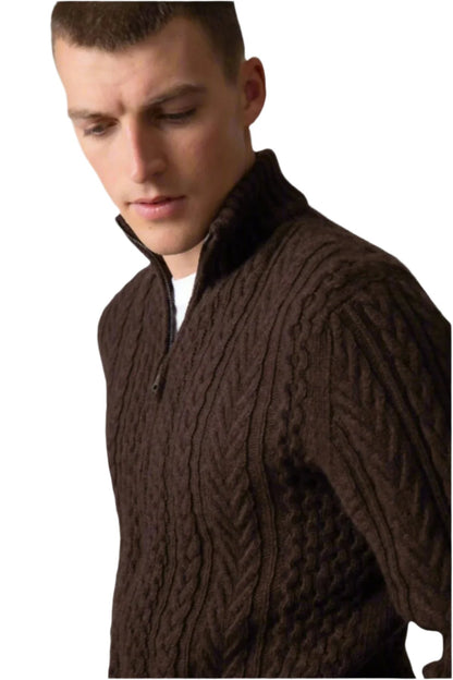 Johnstons of Elgin’s Men's Aran Cable Cashmere Zip Cardigan in Peat on model on a grey background KAI05119Q23708