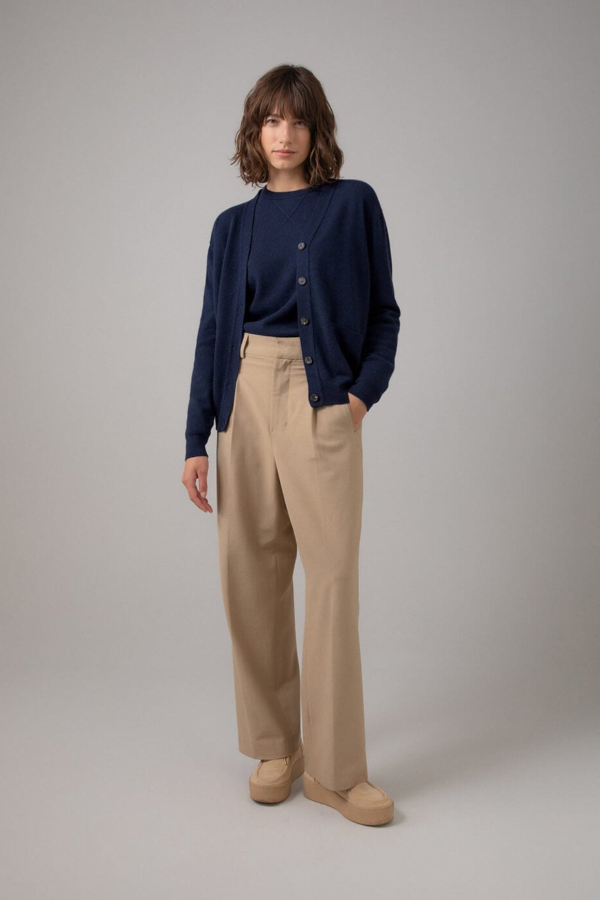 Johnstons of Elgin Women's Cashmere Boyfriend Cardigan in Navy on a white background KAI05141SD0707