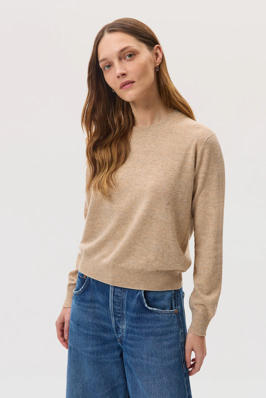 Model wearing Johnstons of Elgin SS25 Women's Knitwear Oatmeal Classic Cashmere Round Neck on a white background KAI05142HB0210