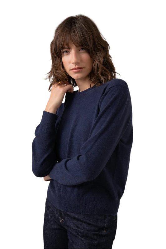 Johnstons of Elgin Classic Women's Cashmere Cropped Round Neck Jumper in Navy on a grey background KAI05142SD0707