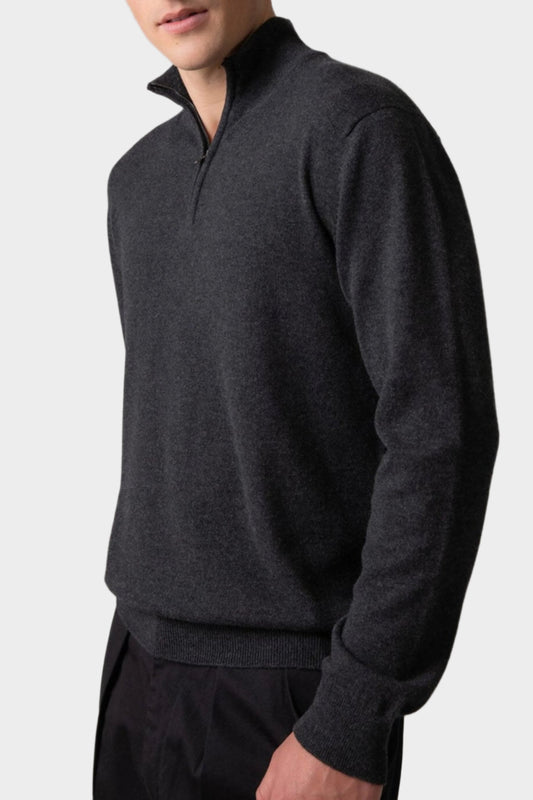 Johnstons of Elgin Men’s Cashmere Zip Neck Jumper in Charcoal grey on model wearing black trousers on grey background KAI05151HA7165