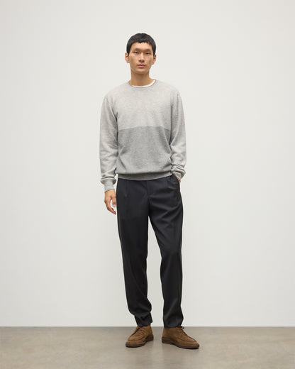 MODEL WEARING JOHNSTONS OF ELGIN MENS SHADED CREW SWEATER LIGHT GREY 100% CASHMERE OVER A WHITE T-SHIRT WITH GREY TROUSERS KAI05232Q25946