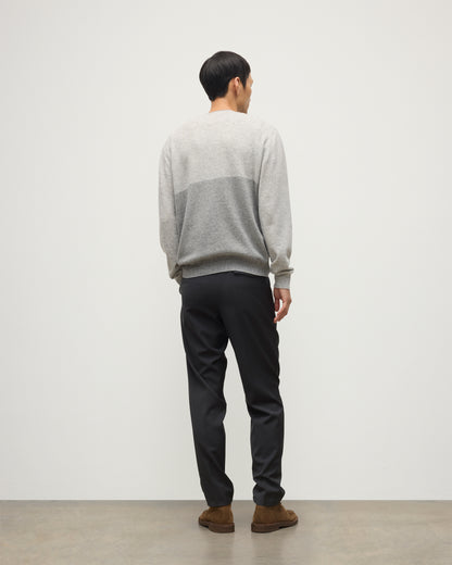 MODEL WEARING JOHNSTONS OF ELGIN MENS SHADED CREW SWEATER LIGHT GREY 100% CASHMERE OVER A WHITE T-SHIRT WITH GREY TROUSERS KAI05232Q25946