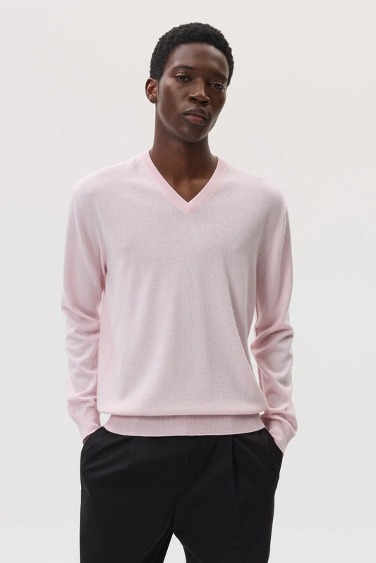 Model wearing Johnstons of Elgin SS25 Men's Knitwear Rose Classic Cashmere V Neck Sweater with black trousers  KAI05266SE0208