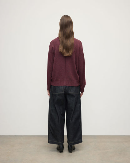 Model wearing Johnstons of Elgin AW25 Women's Knitwear Damson Gauzy Cashmere Purple V Neck Jumper Back View KAI05323HE7064