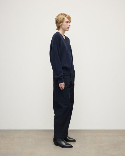 Model wearing Johnstons of Elgin AW25 Women's Knitwear Dark Navy Gauzy Cashmere Navy V Neck Jumper Side View KAI05323SD7666