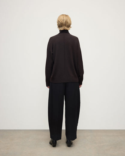 Model wearing Johnstons of Elgin AW25 Women's Knitwear Molasses Gauzy Cashmere Brown Roll Neck Jumper Back View KAI05324SB7290
