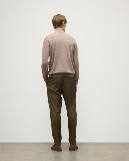 MODEL WEARING JOHNSTONS OF ELGIN MENS SUPERFINE FIN ROLL COLLAR GREY 100% SUPERFINE CASHMERE WITH OLIVE TROUSERS KAI05333HB0273