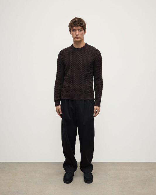 Model wearing Johnstons of Elgin AW25 Men's Knitwear Molasses Aran Cable Brown Cashmere Jumper Front KAI05336SB7290