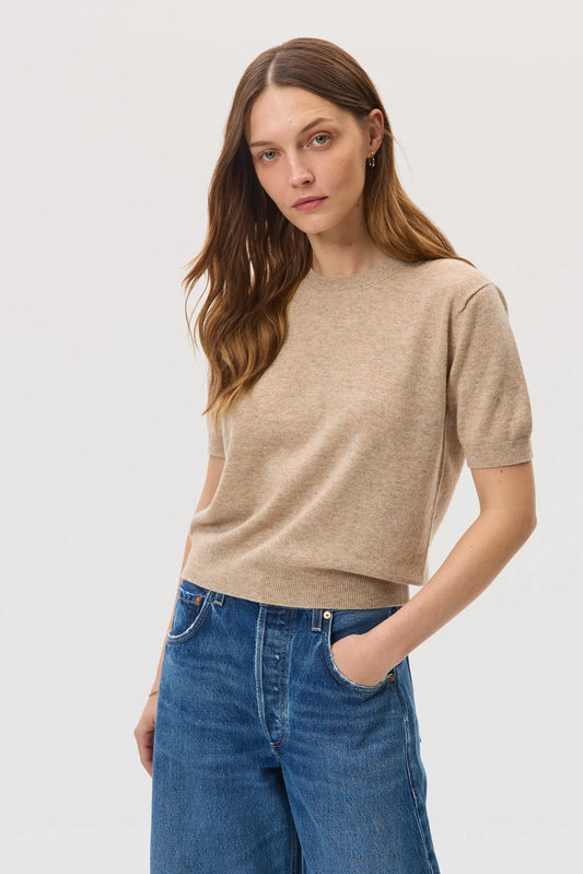 Model wearing Johnstons of Elgin SS25 Women's Knitwear Oatmeal Classic Cashmere T-Shirt with blue barrel leg jeans  KAI05371HB0210