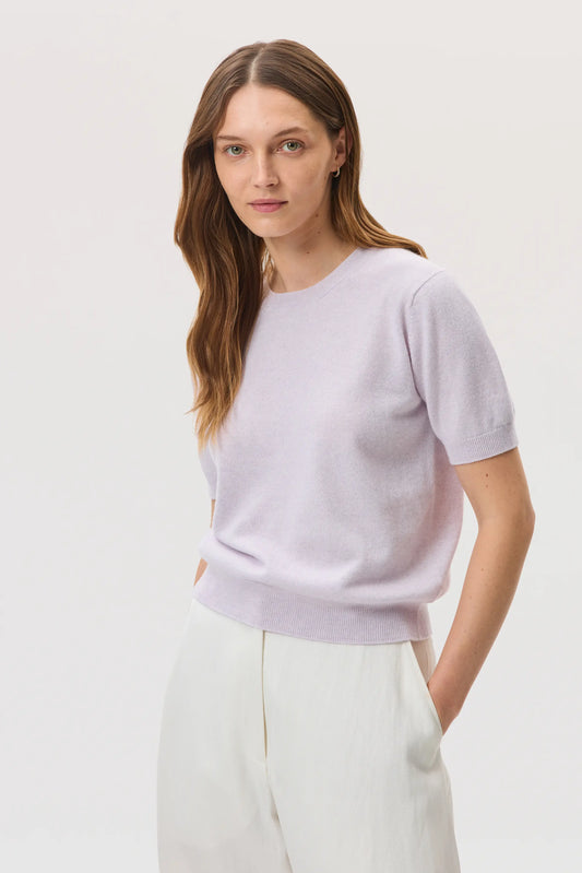 Model wearing Johnstons of Elgin SS25 Women's Knitwear Lavender Classic Cashmere T-Shirt on a white backdrop  KAI05371HD0086