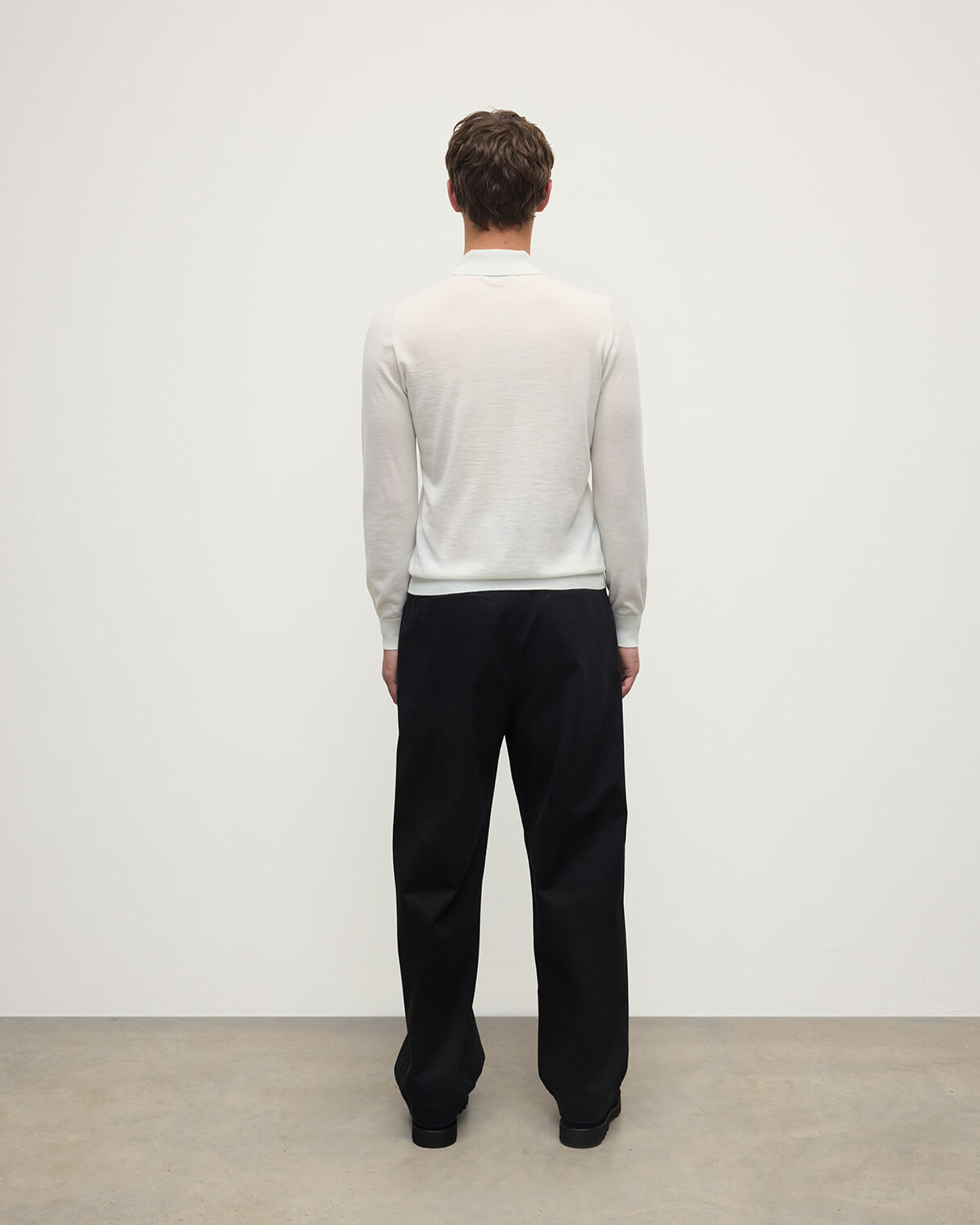 Model wearing Johnstons of Elgin AW25 Men's Knitwear Zinc White White Cashmere Polo Shirt KAI05481HA0327