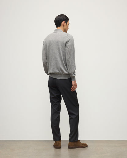 MODEL WEARING JOHNSTONS OF ELGIN MENS FIN SUPERFINE LONG SLEEVE POLOSHIRT GREY 100% SUPERFINE CASHMERE WITH BLACK TROUSERS KAI05481HA4253