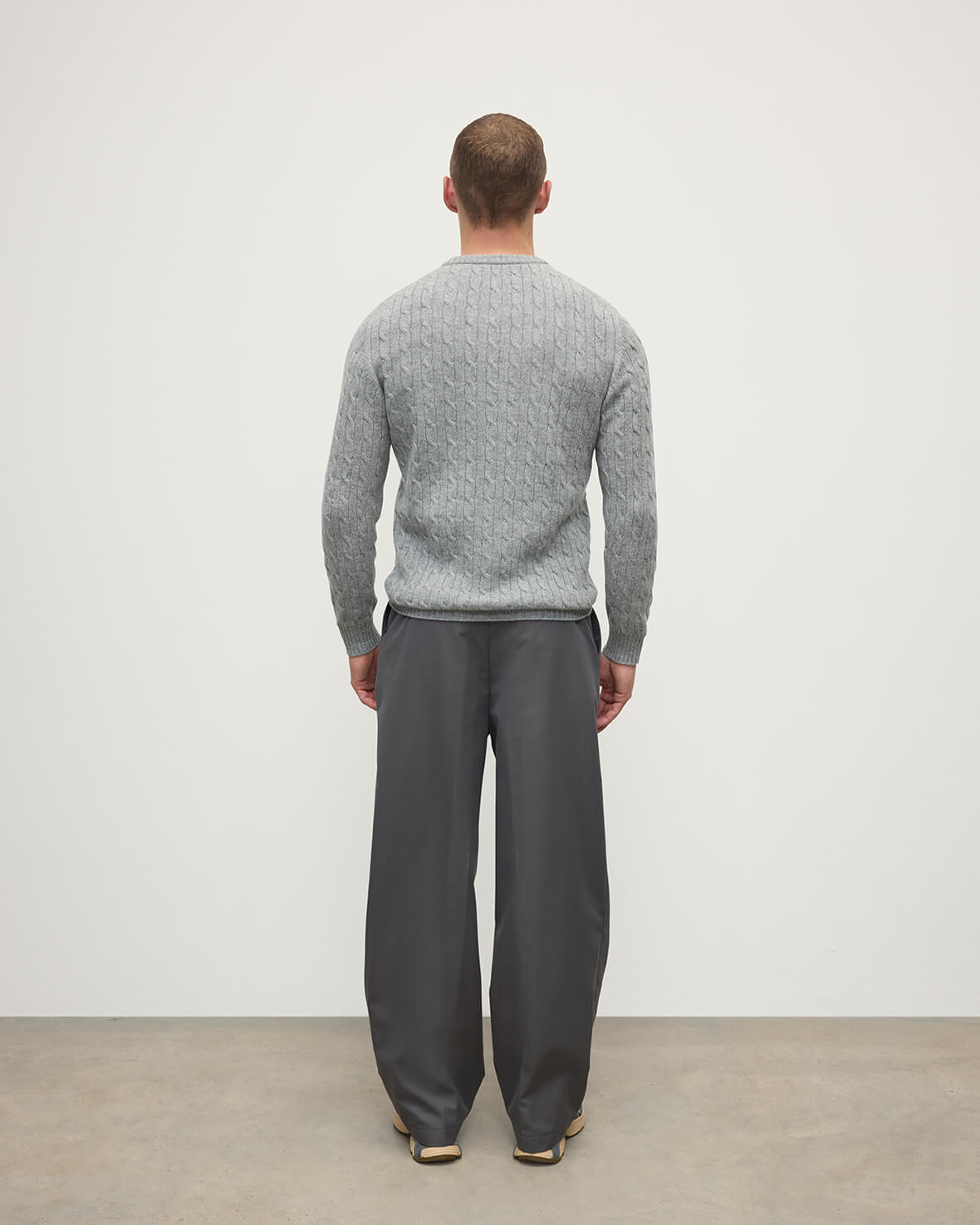 Model wears Johnstons of Elgin AW25 Men's Knitwear Light Grey Cable Knit Grey Cashmere Jumper Back KAI05693HA0308